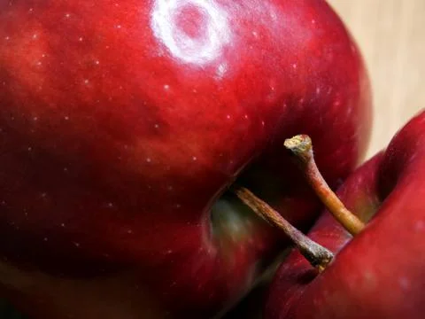 Two red chief apples close-up. Macro shot of ripe red apples. Stock Photos