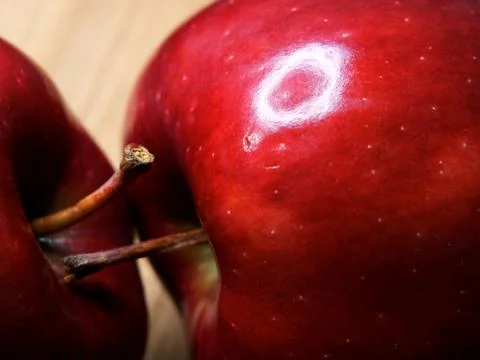 Two red chief apples close-up. Macro shot of ripe red apples. Stock Photos