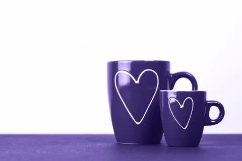 Two red cups of tea or coffee with hearts Stock Photos