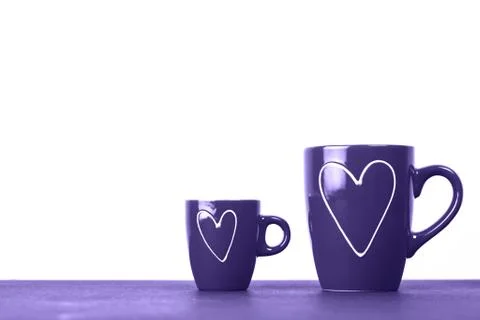 Two red cups of tea or coffee with hearts Stock Photos