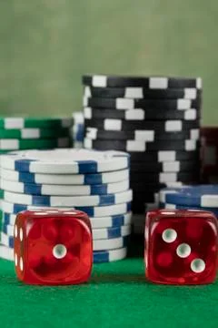 Two red dices and different color chips Stock Photos