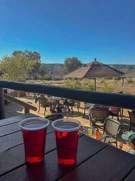 Two red drinks on patio table in Grand Canyon National Park Stock Photos