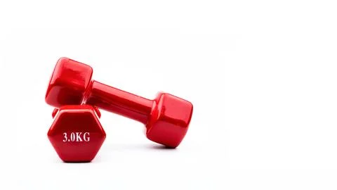 Two red dumbbells isolated on white background with copy space for text. 3... Stock Photos