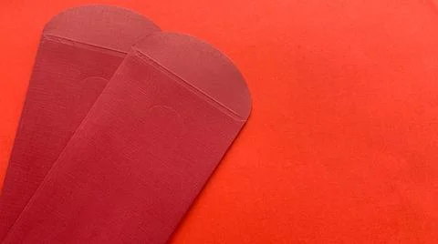 Two red envelopes with red background. Chinese New Year concept. Stock-Fotos