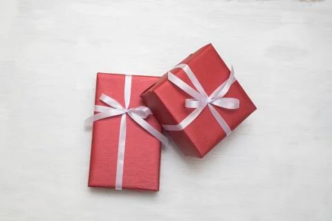 Two Red gift box with white ribbon isolated on white background. Stock Photos