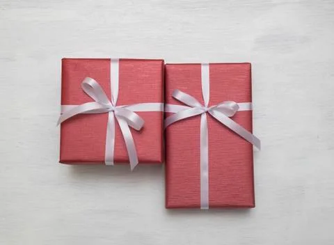 Two Red gift box with white ribbon isolated on white background. Stock Photos