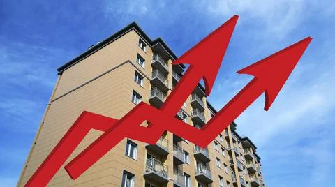 Two red growing up large arrow on residential building background. Rising Stock Photos
