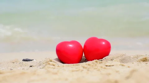 Two red heart shape on summer beach vacation time to travel. Tropical summer bea Stock Footage 276721121