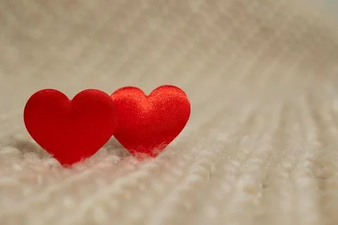 Two Red Heart Shapes on Soft Fabric, Perfect for Digital Designs Celebrating Stock Photos