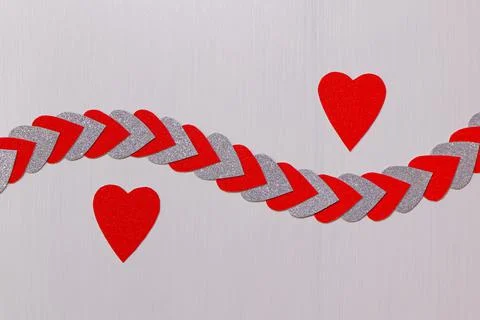 Two Red Hearts Apart With String Of Hearts On Textured White Stock Photos