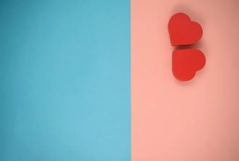 Two red hearts on blue and pink background Stock Photos