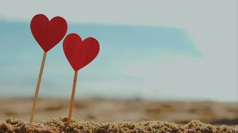Two red hearts close-up . Summer holidays for two at sea concept Video stock 122768735