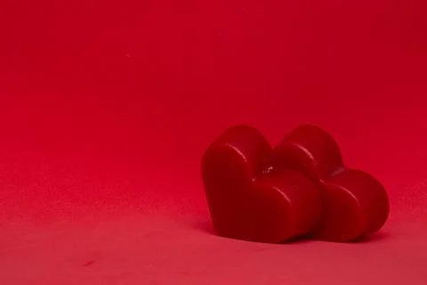 Two red hearts on a red background (valentine's day) Stock Photos