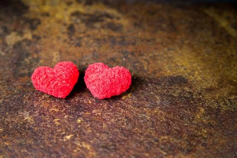 Two red hearts. On a rusty background. Valentine's day, love. 库存照片