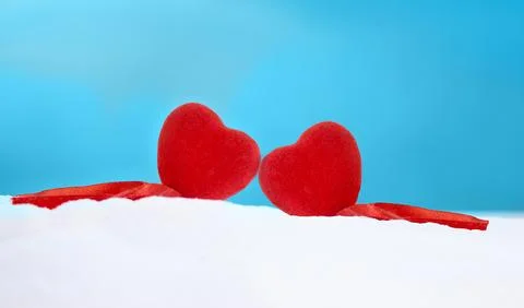 Two red hearts side by side in the snow. Saint Valentine's day, love Stock Photos