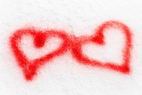 Two red hearts, sprayed in the snow Fotos Stock