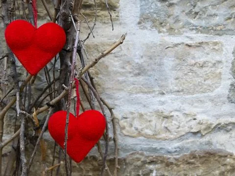 Two red hearts on a wall background Valentine's Stock Photos