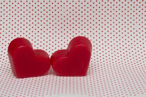 Two red hearts on a white background with red polka dots (valentine's day) Stock Photos