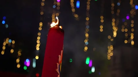 Two red incense stick with a flame on top Stock Footage 314389214