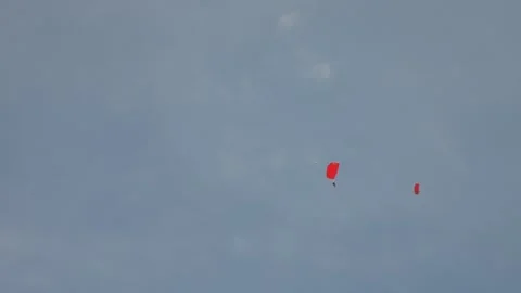 Two Red Parachutes Turning Video stock 309788390
