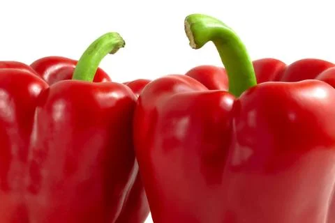 Two red peppers with green stalks close up. Two red peppers with green sta... Stock Photos