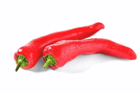 Two red peppers on white background with drops of water, isolate Stock Photos