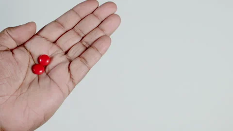 Two Red Pills In Hand Stock Footage 248756652