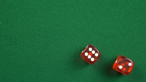 Two red roll dices and stops on the table with 6 and 2 in slow motion. Stock Footage 209143543