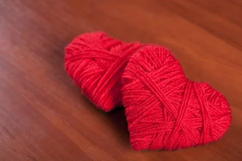 Two red thread hearts Stock Photos