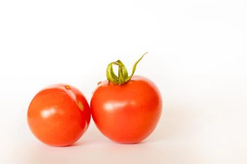 Two red tomatoes isolated on white background Stock Photos