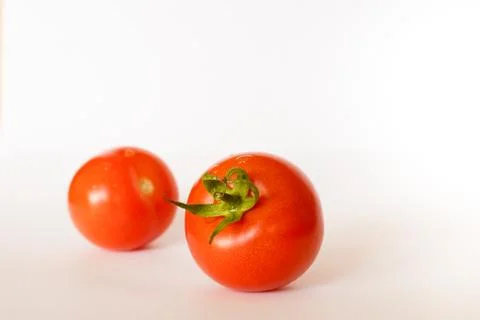 Two red tomatoes isolated on white background Stock Photos