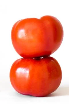Two red tomatoes in a pile isolated on white background Stock Photos