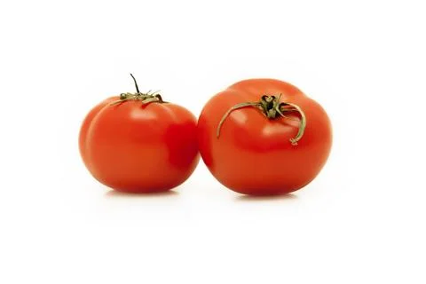Two red tomatoes on white background Stock Photos
