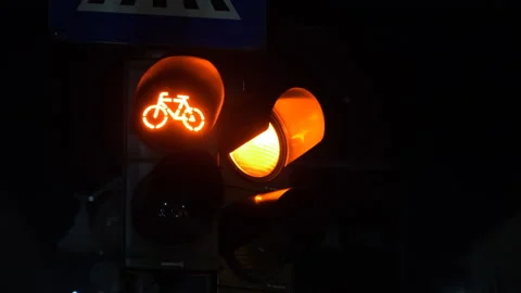 Two red traffic lights with bicycle logo on one at night in Bucharest, Romania Stock Footage 145170205