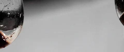 Two red wine glasses crashing in slow motion Stock Footage 85801002