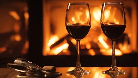 Two red wine wineglasses over fireplace background. 動画素材 82542921