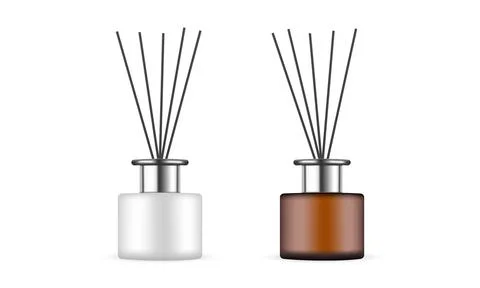 Two Reed Diffuser Bottles with Metal Caps, Amber and Ceramic Stock Illustration