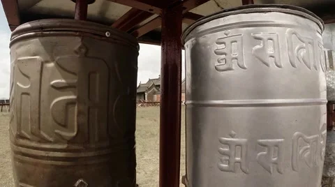 Two reels of old prayer mantras inscribed in Sanskrit close up Stock Footage 54648585