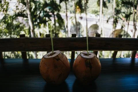 Two refreshing coconut drinks are served on a table Stock Photos