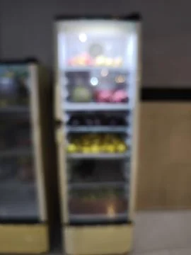 Two refrigerators in a kitchen setting. Stock Photos