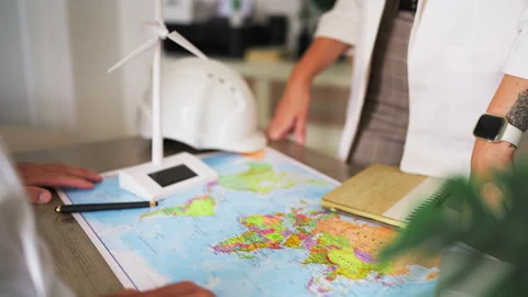 Two renewable energy engineers discussing a global project in their office,.. Stock Footage 346172251