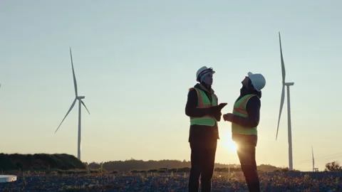 Two Renewable Energy Engineers Working Together at Wind Power Plant Video stock 237218863