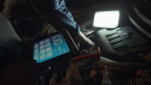 Two Repairmen Testing Car Engine Stock Footage 244840760