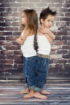 Two resentful kids in studio Stock Photos