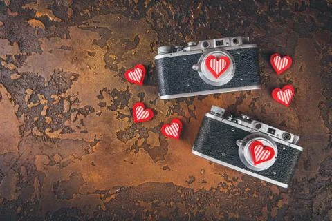 Two retro camera and hearts Stock Photos
