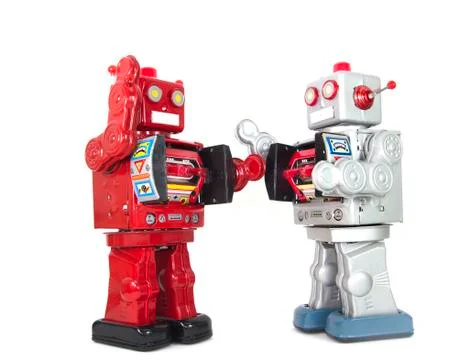 Two retro robots high five each other isolated Stock Photos
