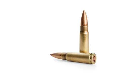Two rifle bullets over white background Stock Photos