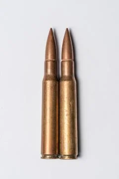 Two rifle bullets on white background. Stock Photos
