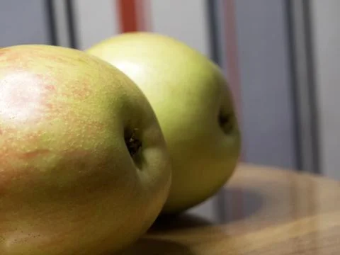 Two ripe apples, side view. A close-up shot of fruit. Stock Photos