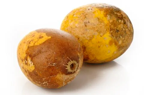 Two ripe bael fruit Stock Photos